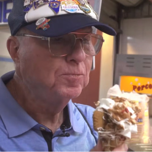 Side-by-side images of man eating a treat at the Texas State fair and a close up of his hat with pins from all the state fairs.