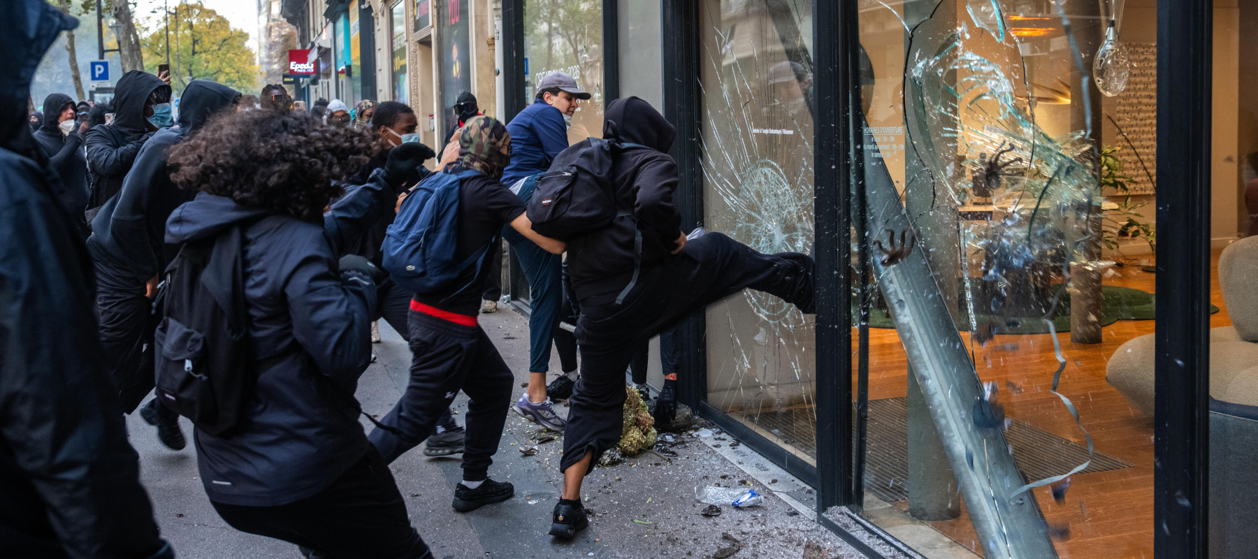 A shop is vandalized and looted during demonstrations on October 17, 2026 in Paris, France