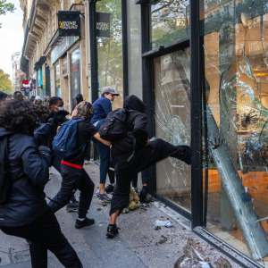 A shop is vandalized and looted during demonstrations on October 17, 2026 in Paris, France