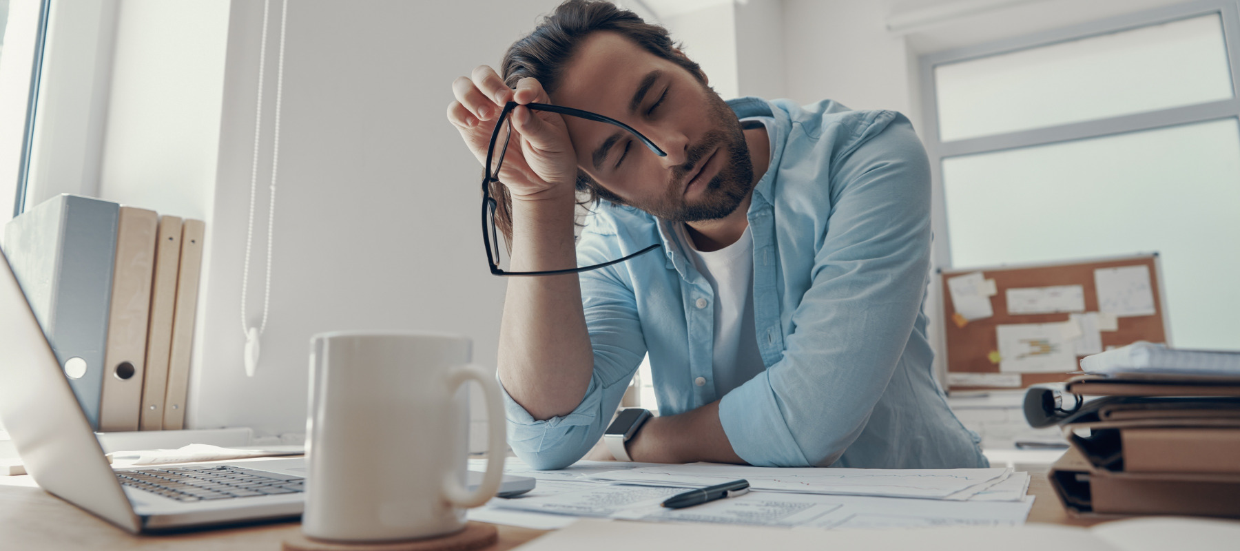 Exhausted man at work.