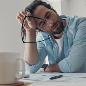Exhausted man at work.