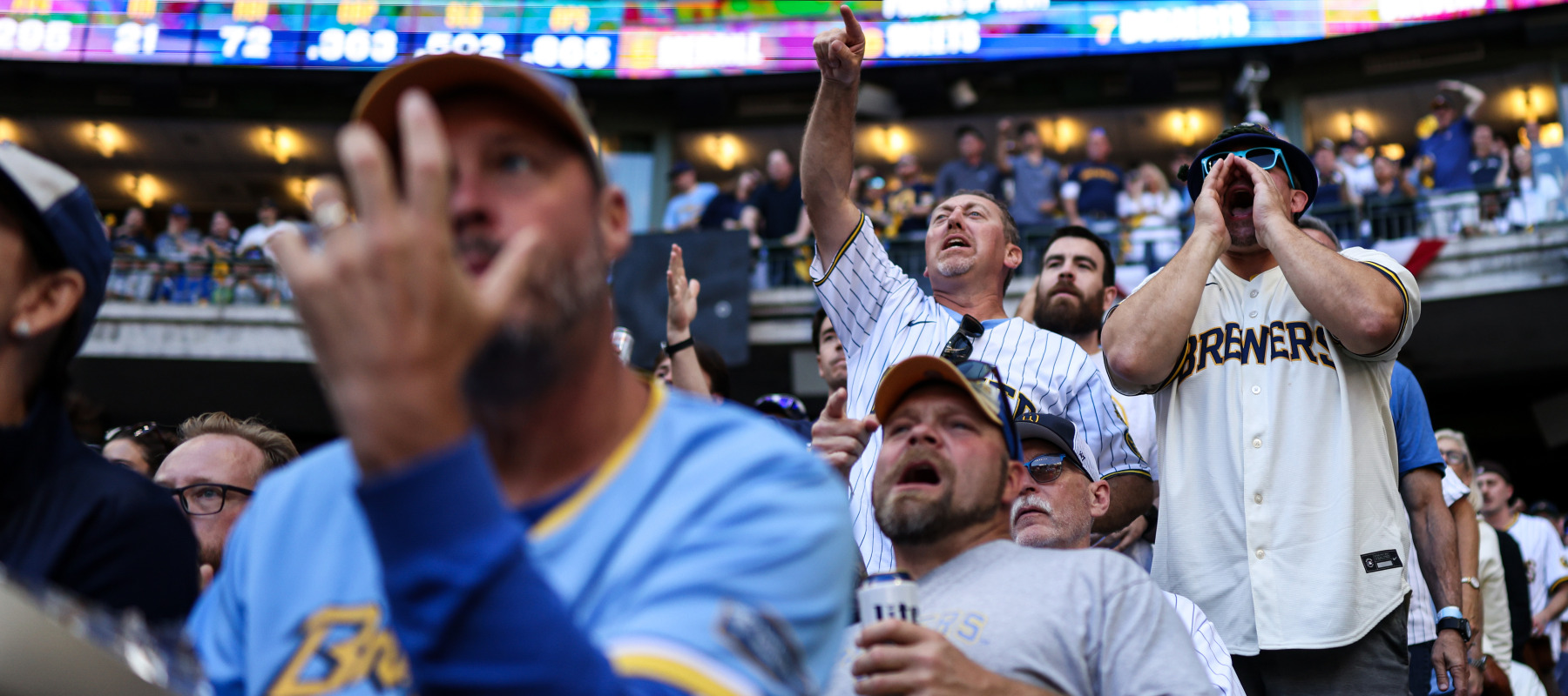 Milwaukee Brewers fans cheer during a game against the San Diego Padres.
