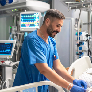 A photo of a nurse caring for a patient in a hospital