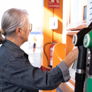 woman gas station and bitcoin machine