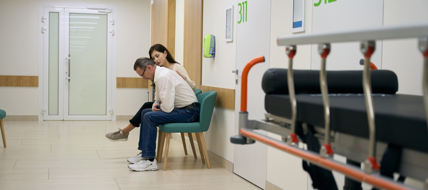 Stressed man and woman waiting at emergency room