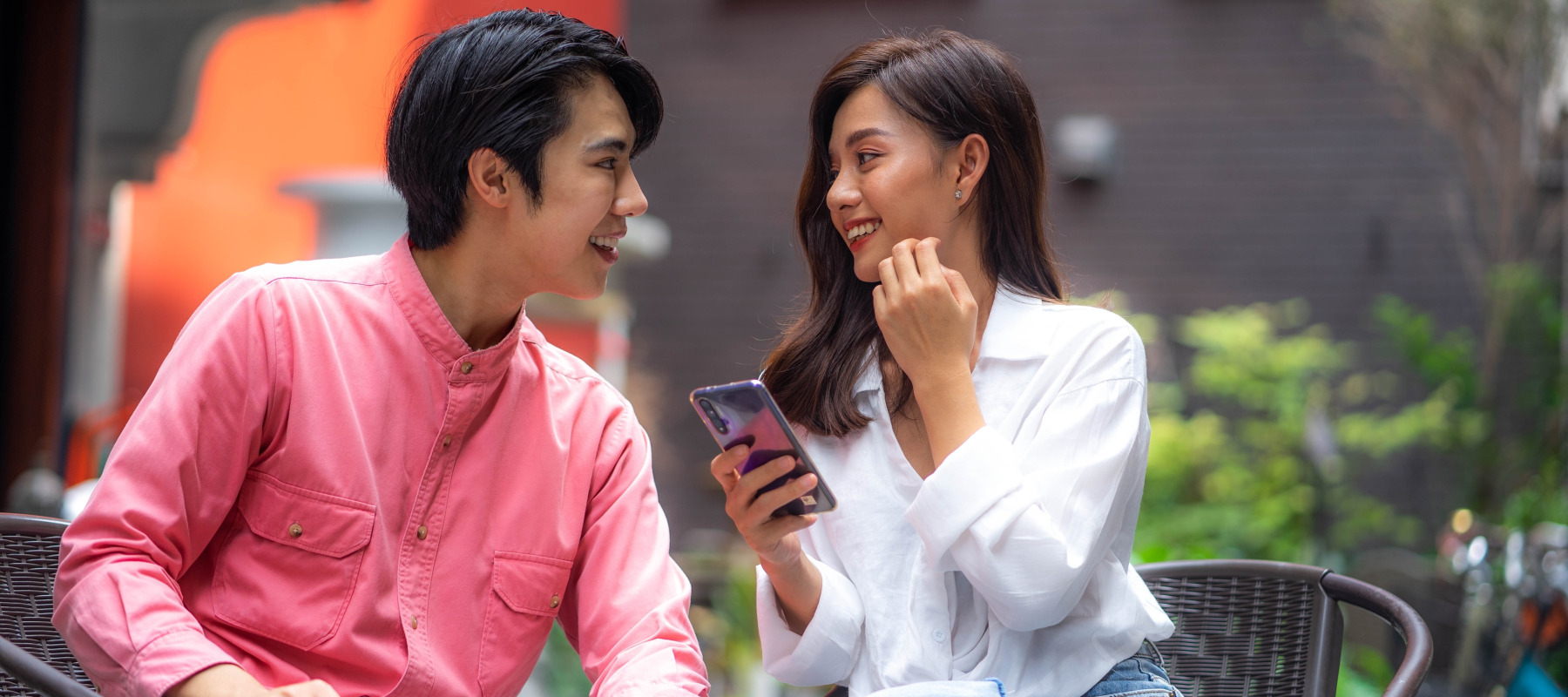 Young Asian couple on a date outside.