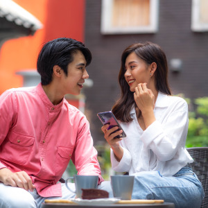 Young Asian couple on a date outside.