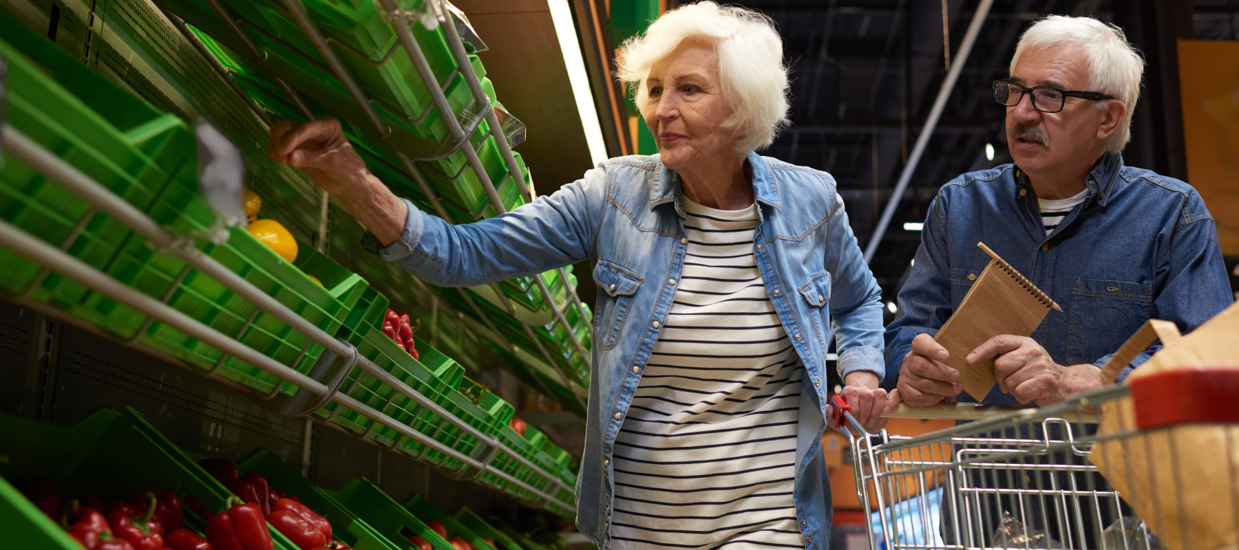 Senior couple buying groceries
