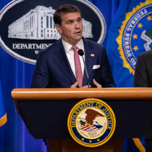 Todd Blanche answers questions at a press conference.