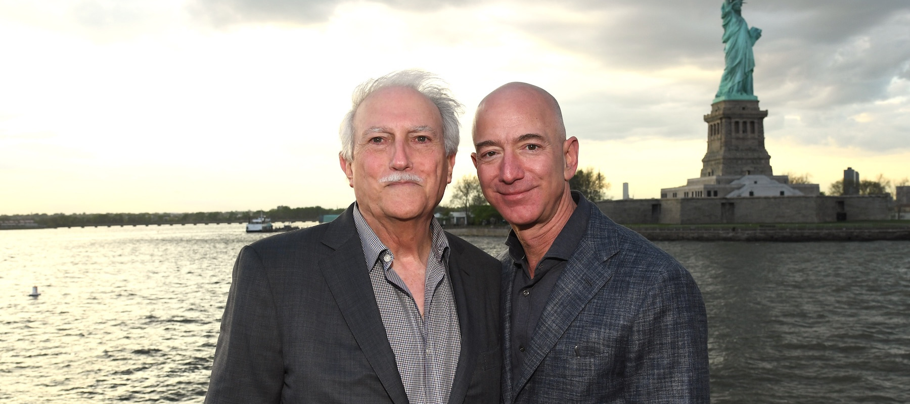 Miguel and Jeff Bezos in front of the Statute of Liberty in 2019.
