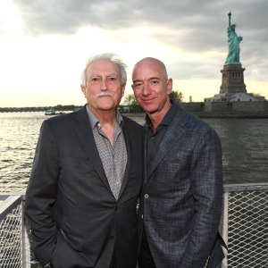 Miguel and Jeff Bezos in front of the Statute of Liberty in 2019.