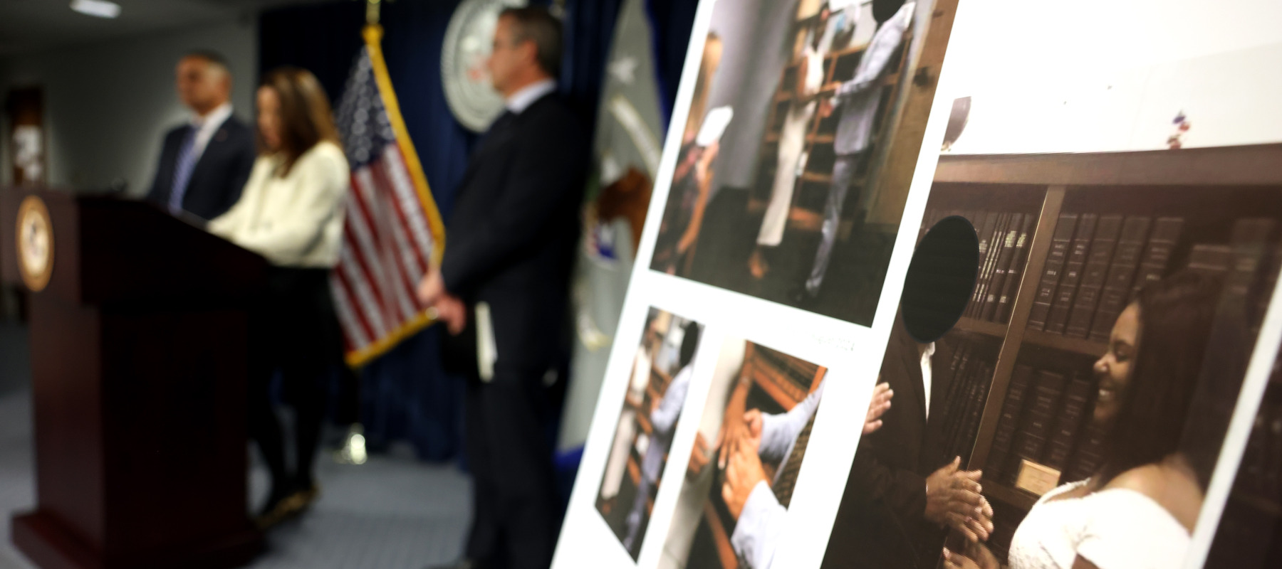 A photo of an alleged fake marriage is seen as Leah Foley, U.S. Attorney for Massachusetts, speaks to reporters during a press conference at the John Joseph Moakley U.S. Courthouse.