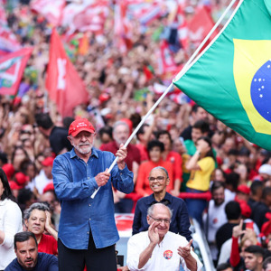 Luiz Inácio Lula Da Silva, incumbent president of Brazil, waves a Brazil flag during a rally