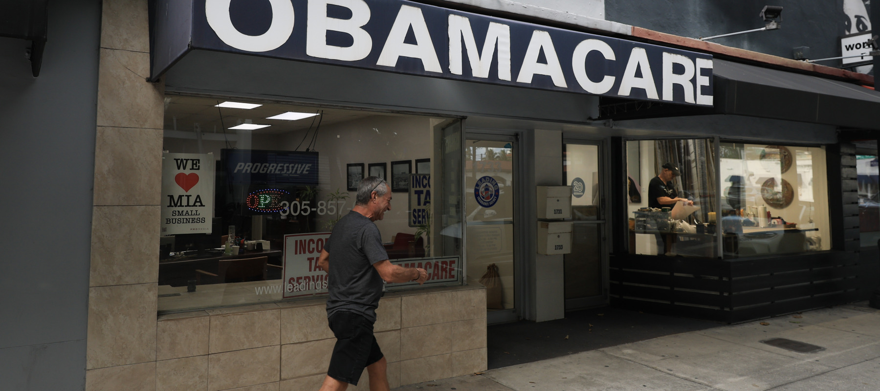 An Obamacare sign is displayed outside an insurance agency in Miami, Florida.