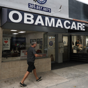 An Obamacare sign is displayed outside an insurance agency in Miami, Florida.