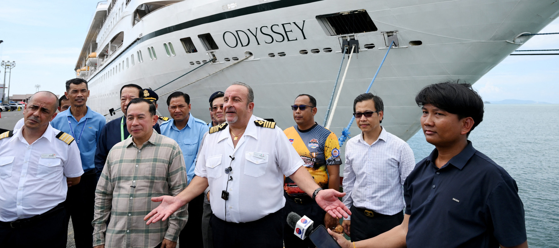 Captain Emanuele Giudice (C) of the Villa Vie Residences' cruise ship speaks to the media.