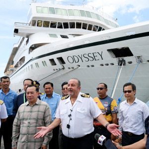 Captain Emanuele Giudice (C) of the Villa Vie Residences' cruise ship speaks to the media.
