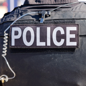 A police office photographed fro behind.