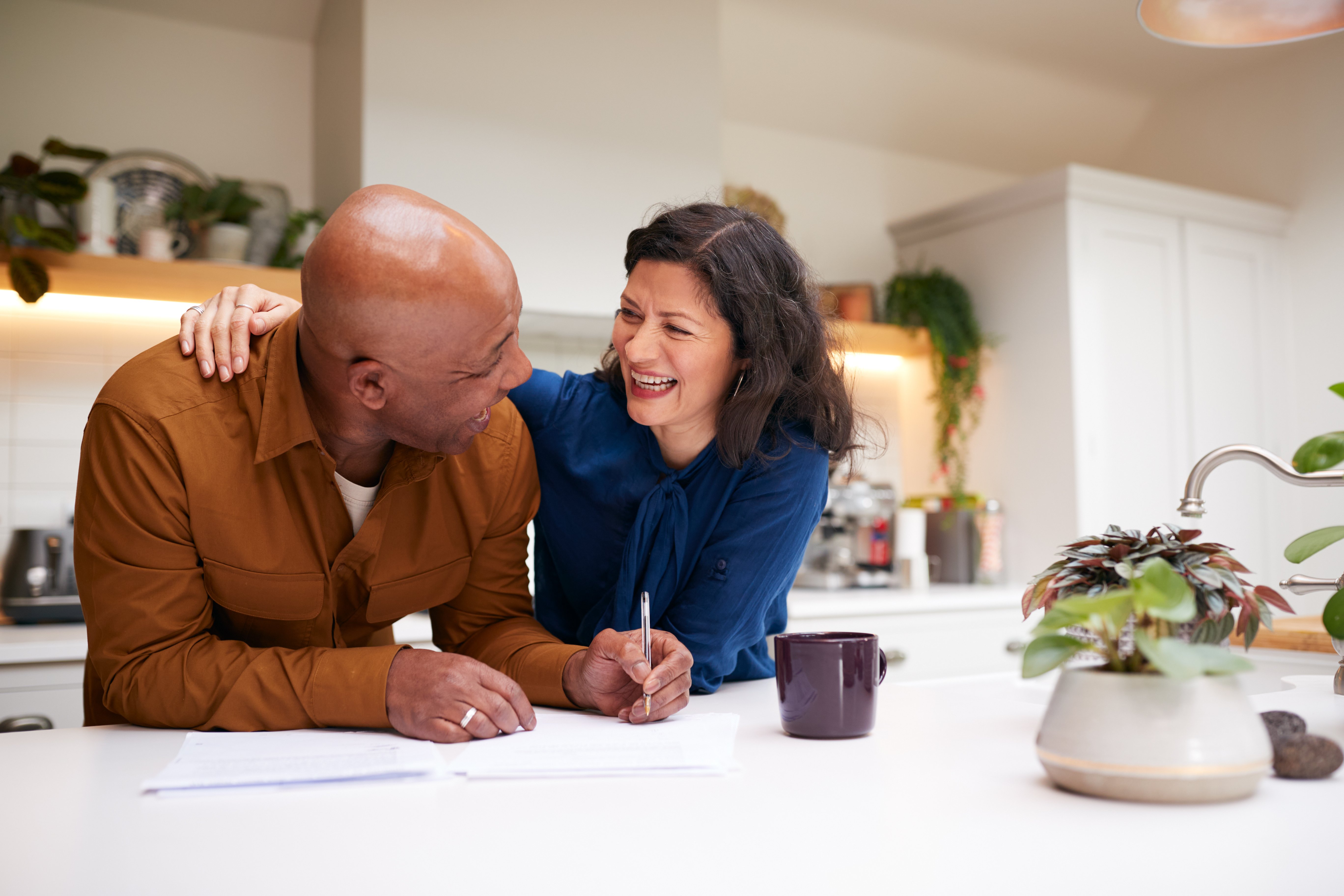 A couple looking pleased at their finances