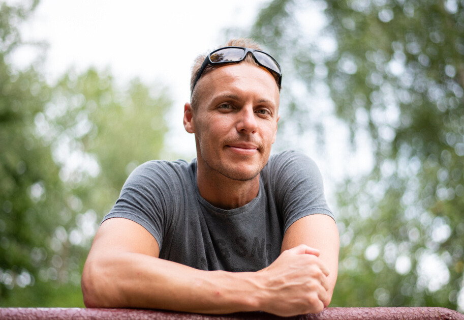 A man in his 30s pictured outside.