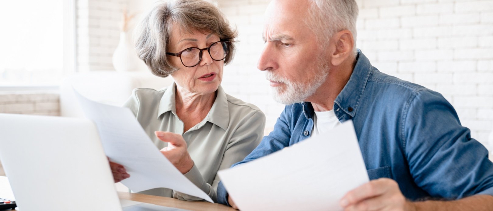 Concentrated concerned european senior old elderly couple