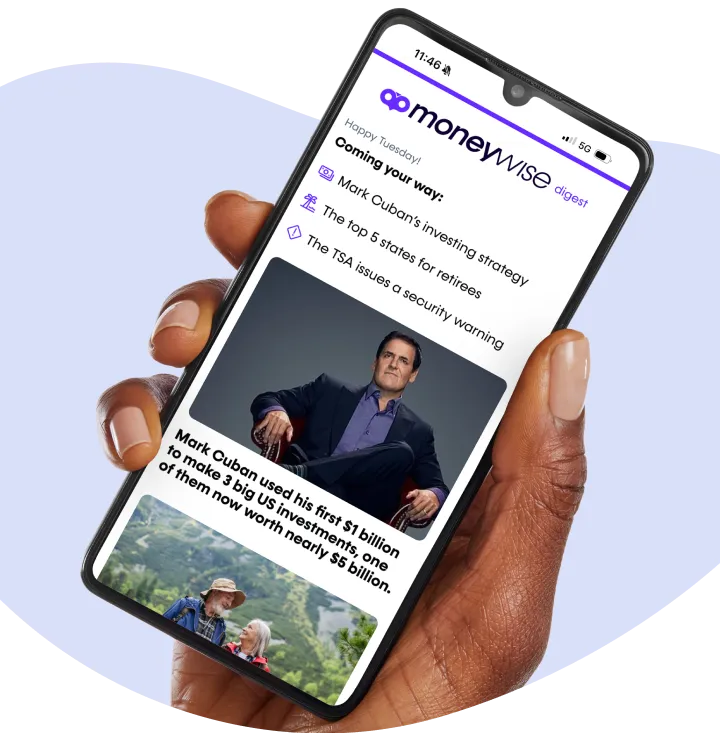 An image showing a hand carrying a phone displaying an article fromMoneywise.com